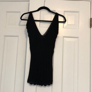 Black crocheted top with flutter sleeves.